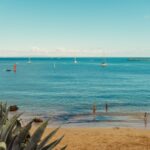 Silver Coast beach cove with sailboats near Caldas da Rainha, Portugal