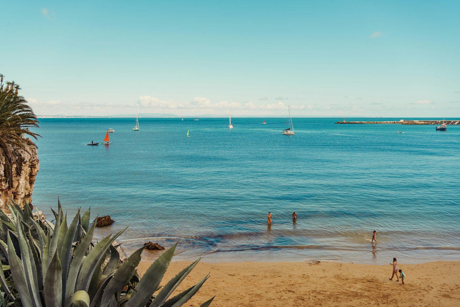 Silver Coast beach cove with sailboats near Caldas da Rainha, Portugal
