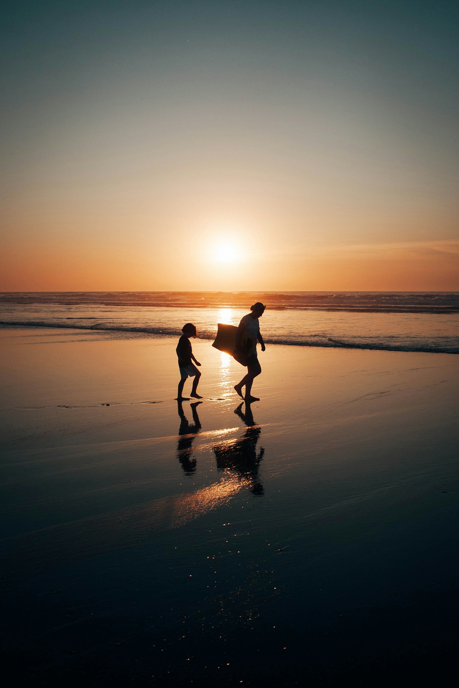 Family on a Silver Coast beach at sunset near Caldas da Rainha